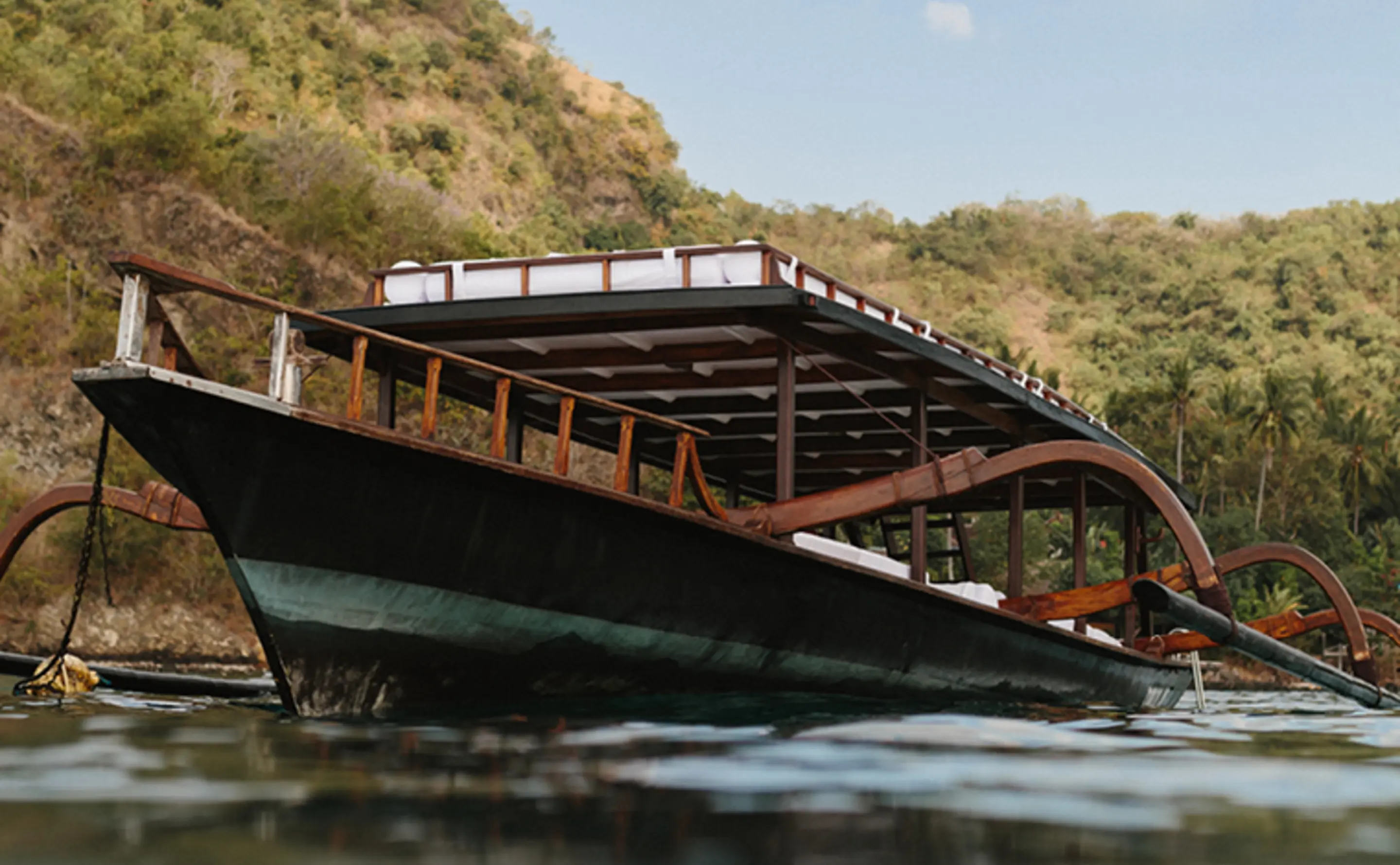 An Amankila Boat beside the Shore