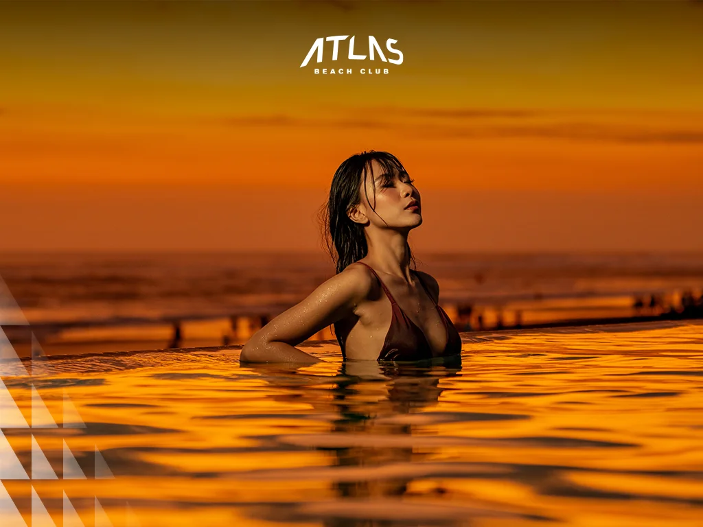 Atlas Beach Club — Pool reflecting the golden sunset