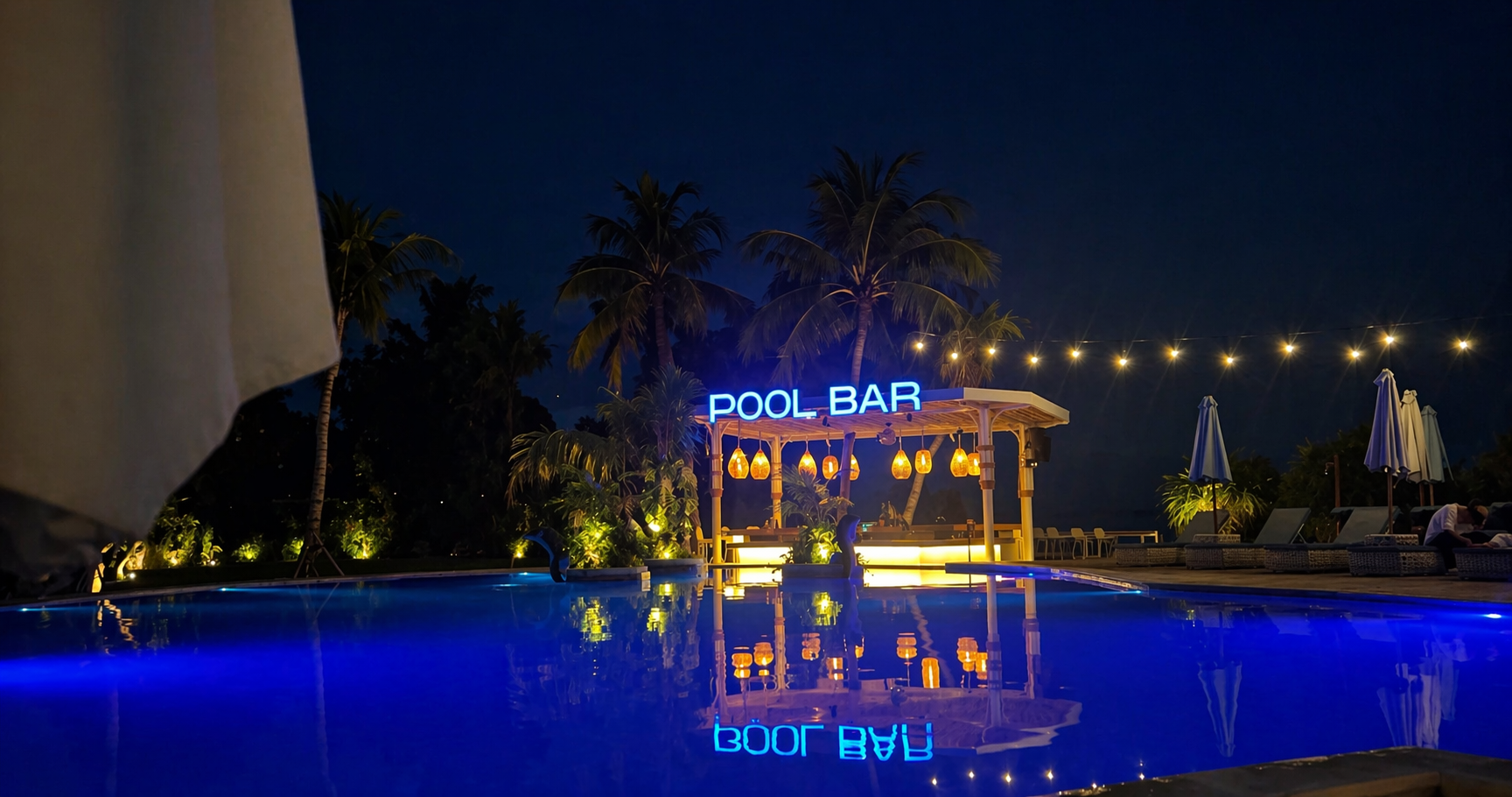 Illuminated Pool Bar at Night