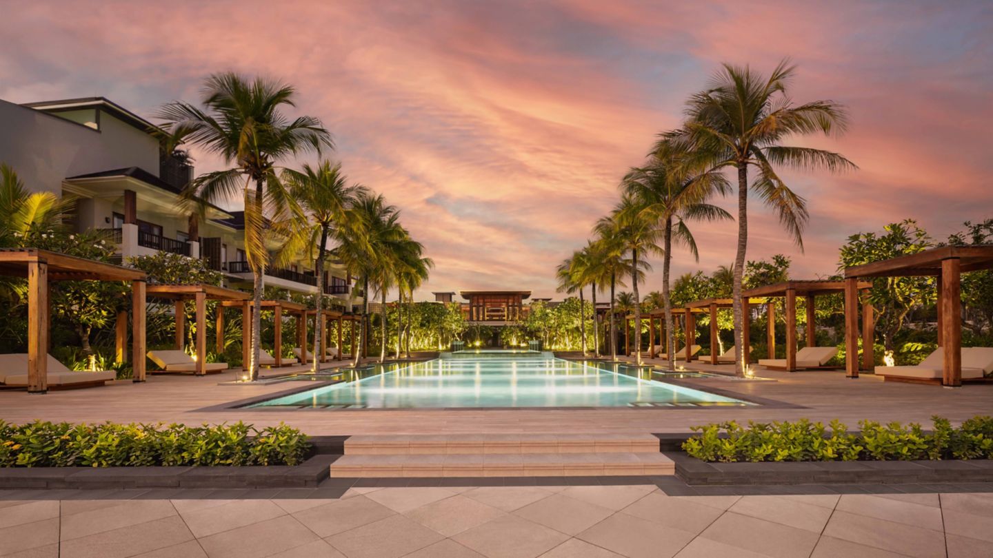 Pool and oceanfront atmosphere at sunset