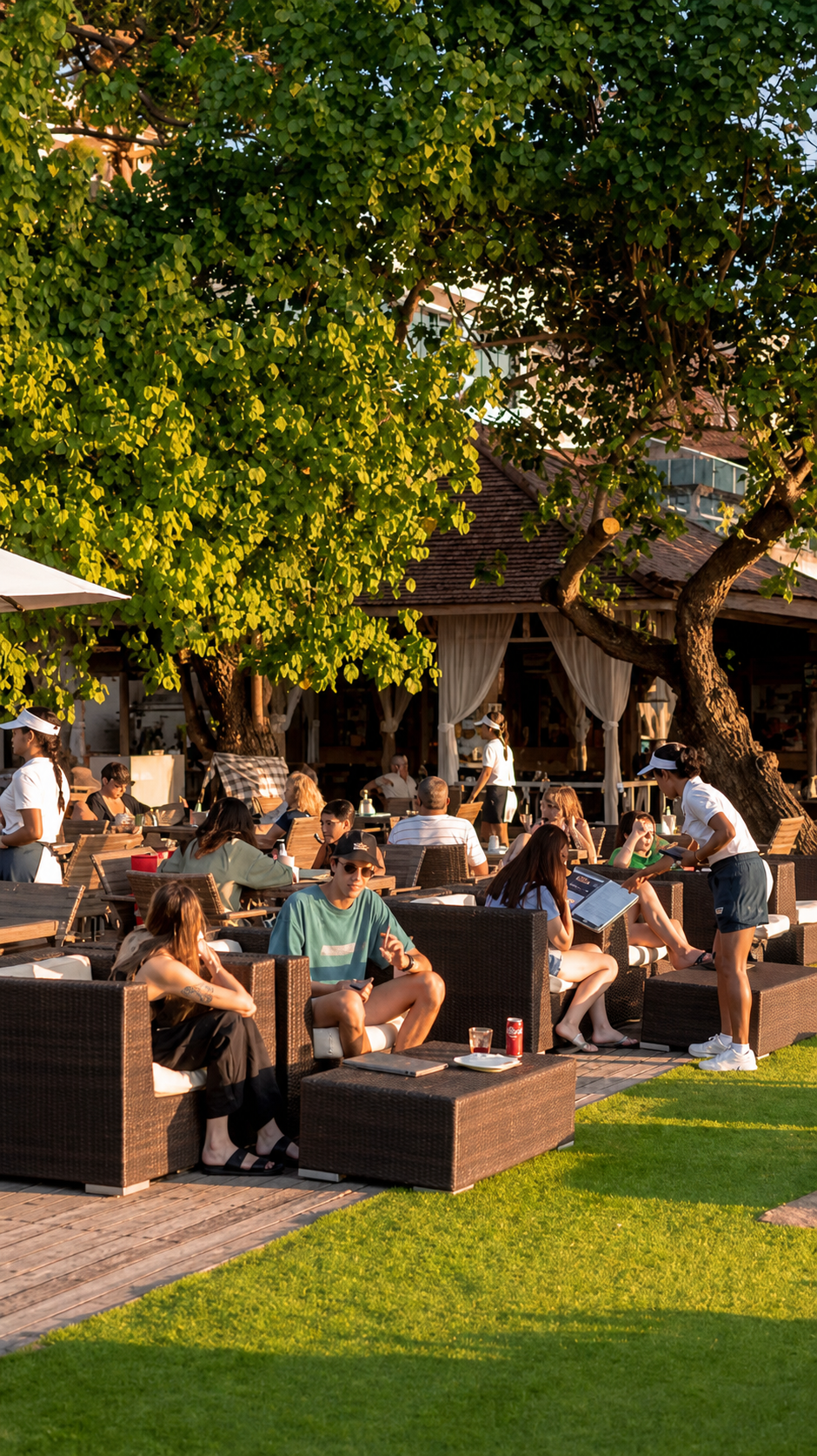 Guests relaxing in Boardwalk's shaded garden seating