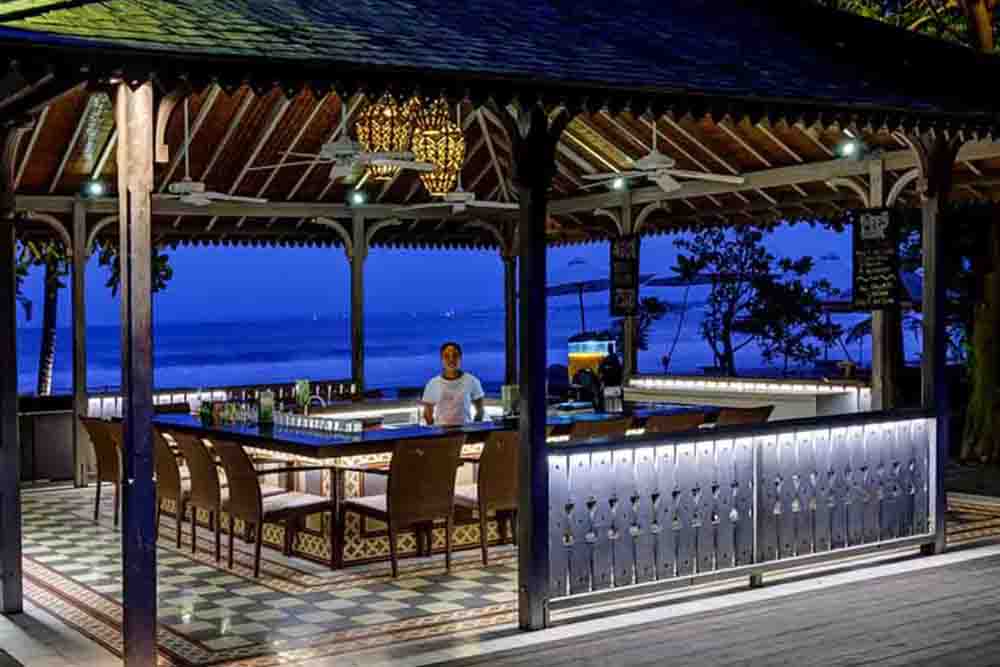 Boardwalk bar counter overlooking the sea at dusk
