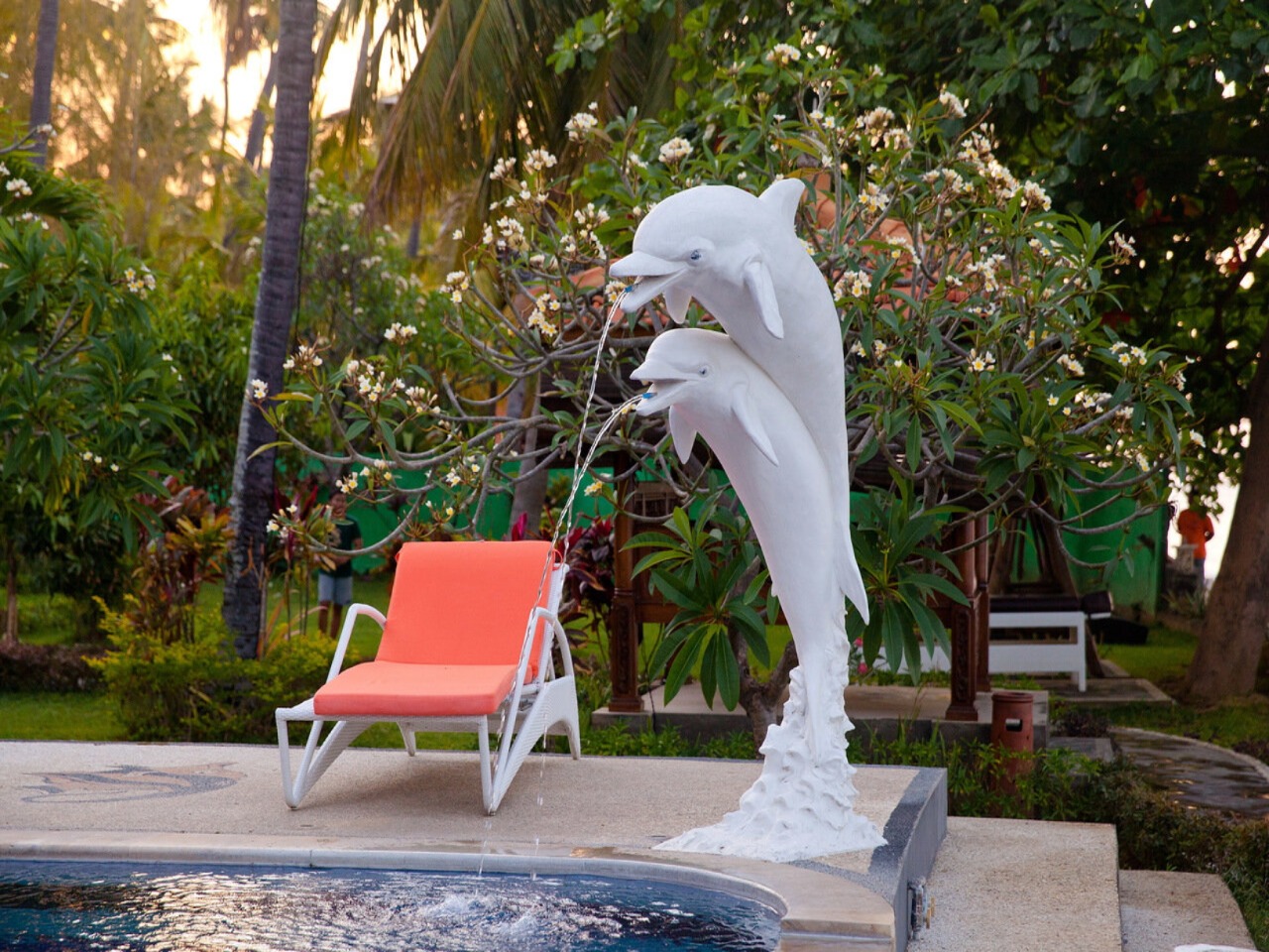 Bondalem Beach Club pool with dolphin fountains and loungers
