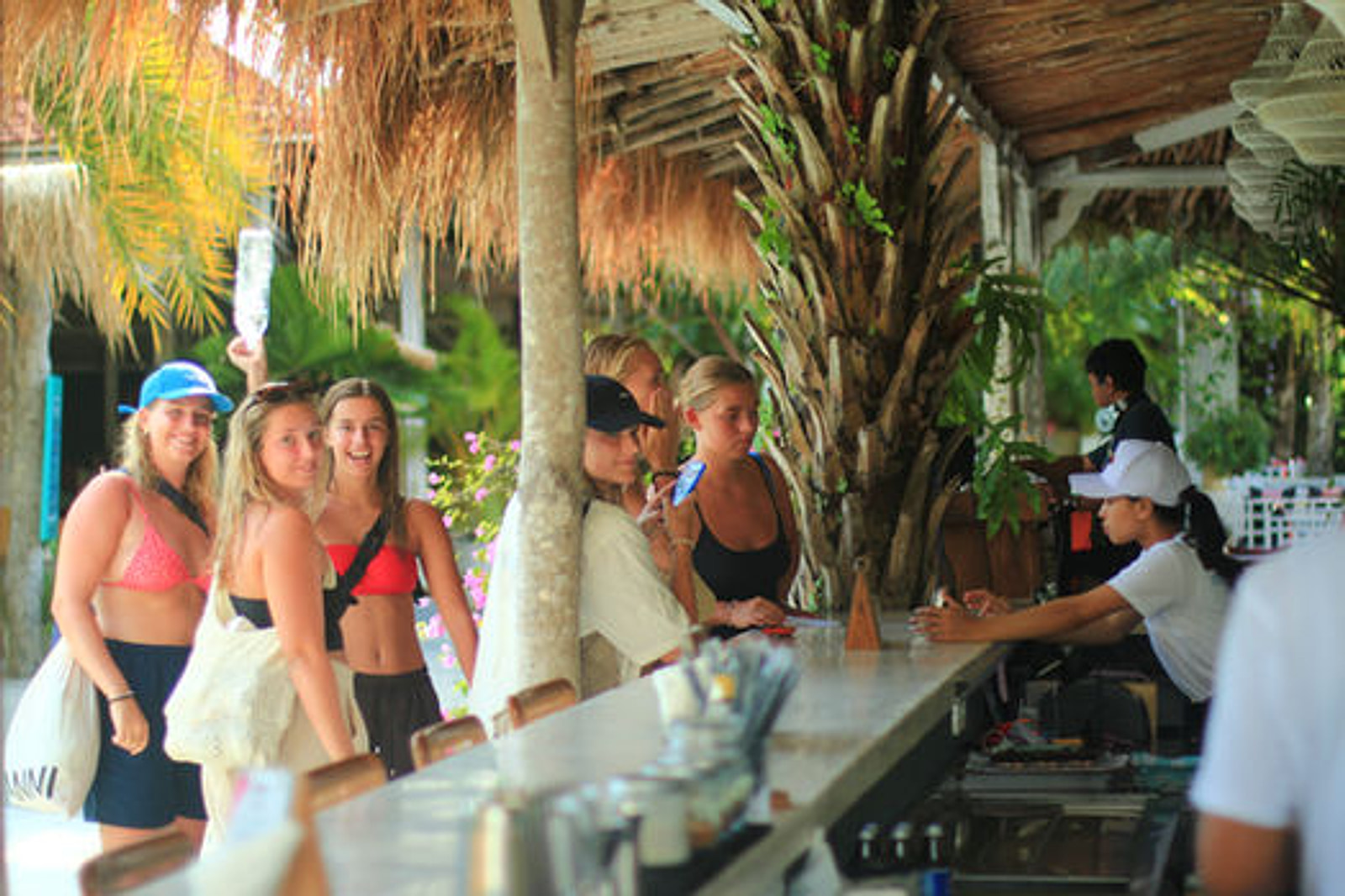 CP Lounge Ubud daytime bar counter and tropical entrance