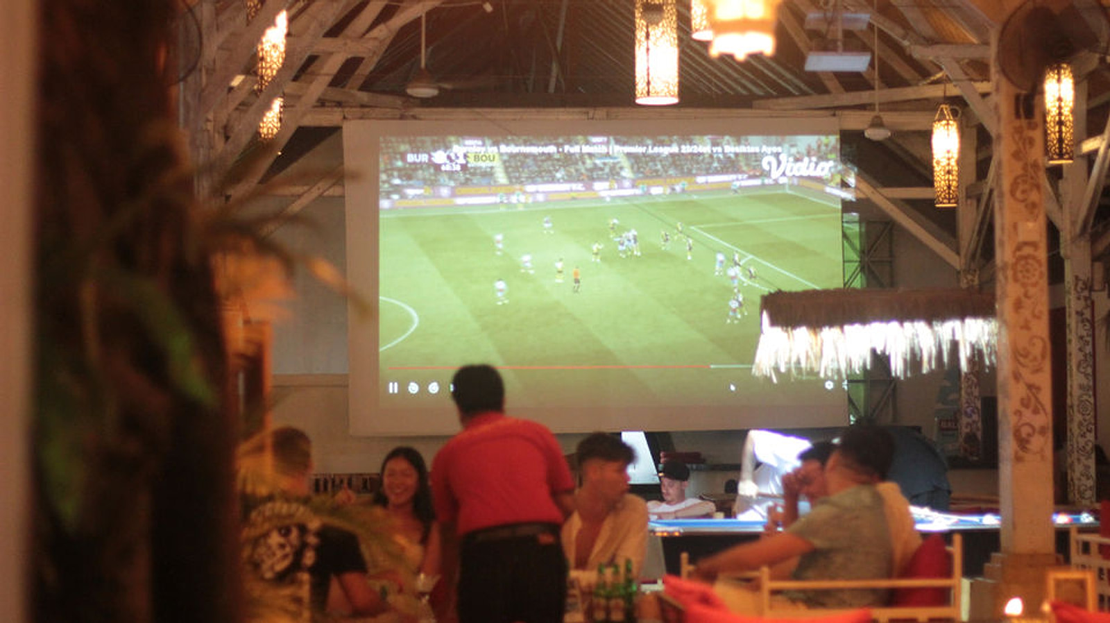 CP Lounge Ubud sports screen and indoor bar mood