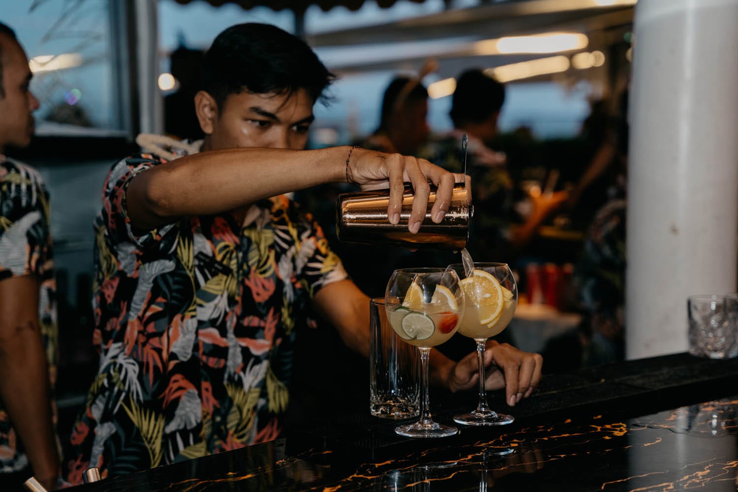 Bartender finishing cocktails
