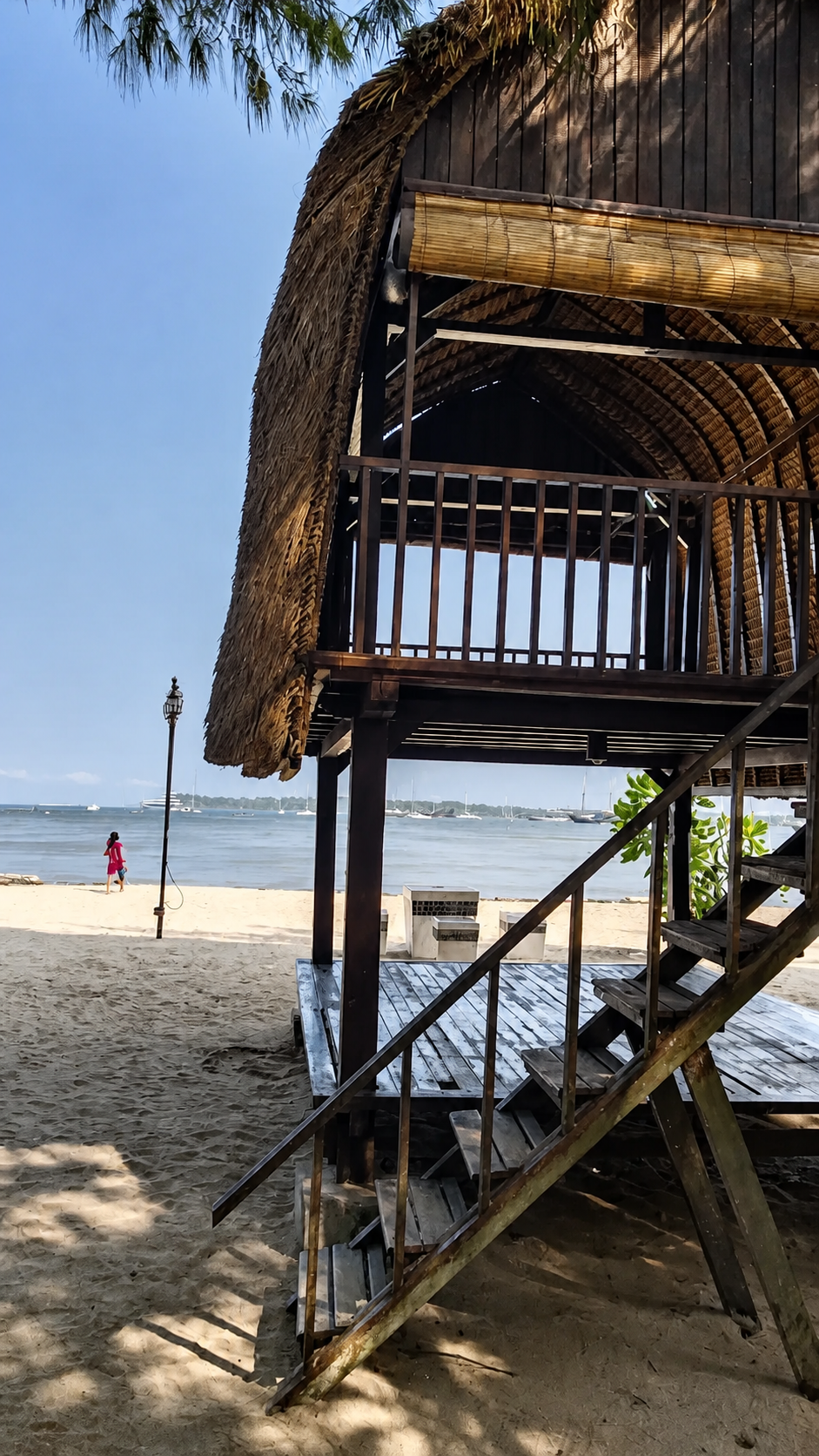 Wooden entrance and deck area at Dream Island Bali Beach Club