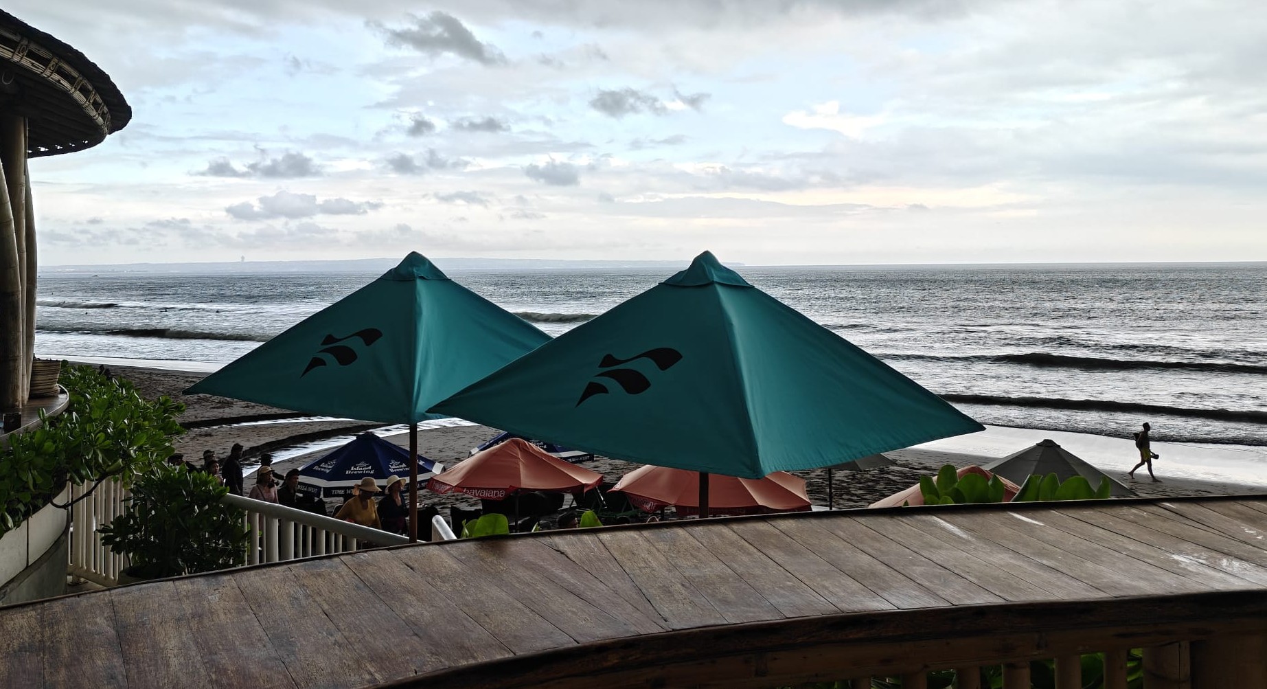 Beachfront angle that keeps the open sea and pre-sunset mood.