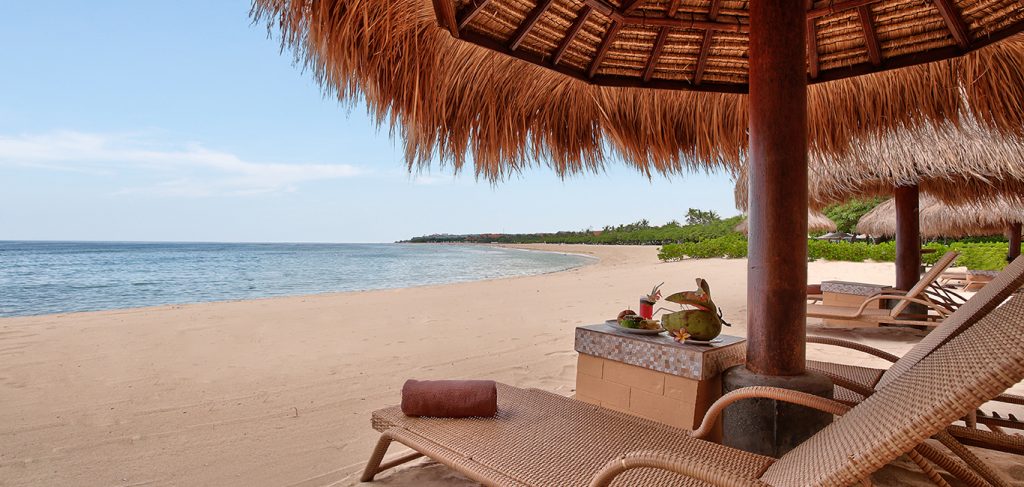 Beachfront lounge photo spot at The Grand Bali Beach Club