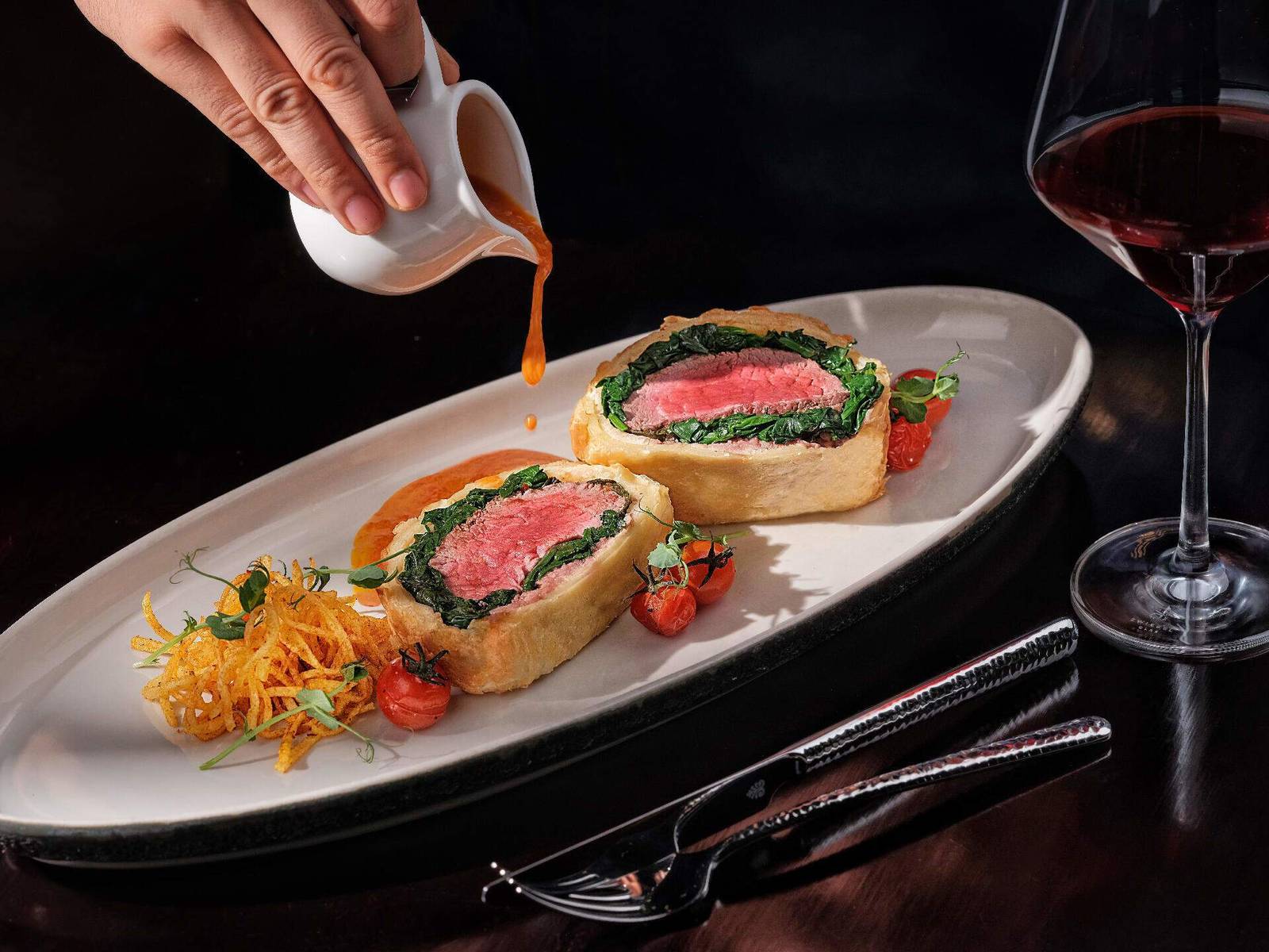 Plated dining dish with wine at Hanging Gardens of Bali