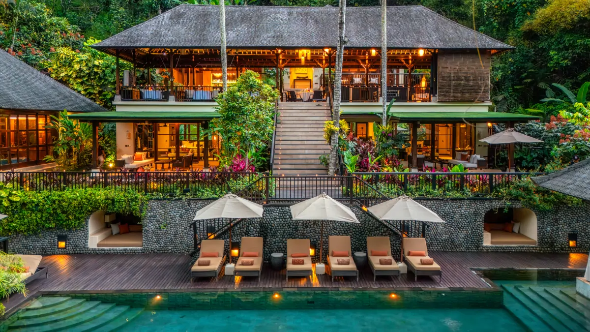 Pool deck, loungers and restaurant building at Hanging Gardens of Bali