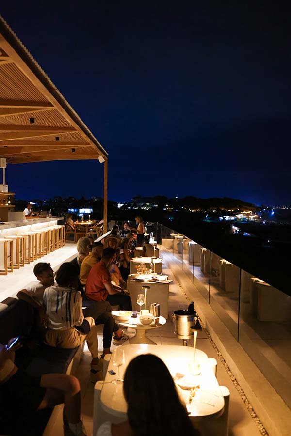 Suasana rooftop bar malam di Hippie Fish Pererenan