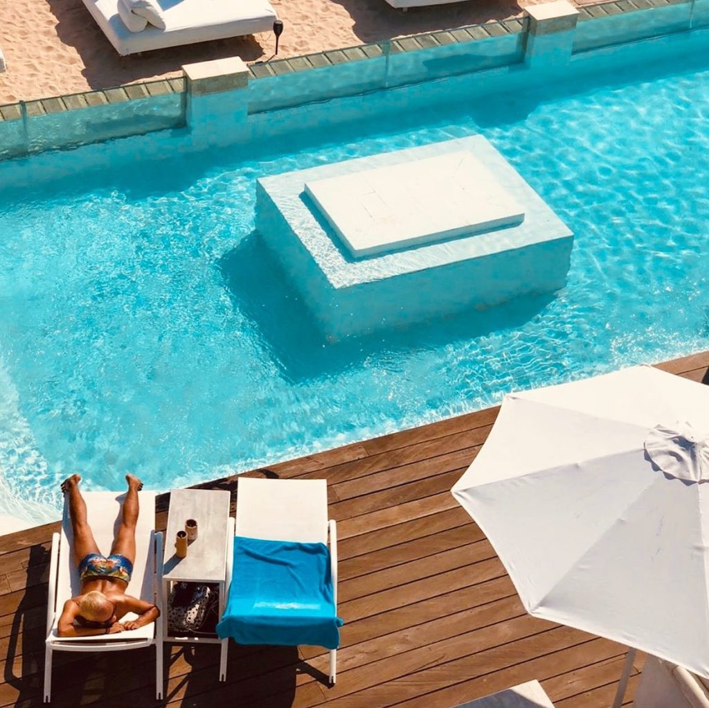 Pool lounge seating at Ibiza In Bali Beach Club