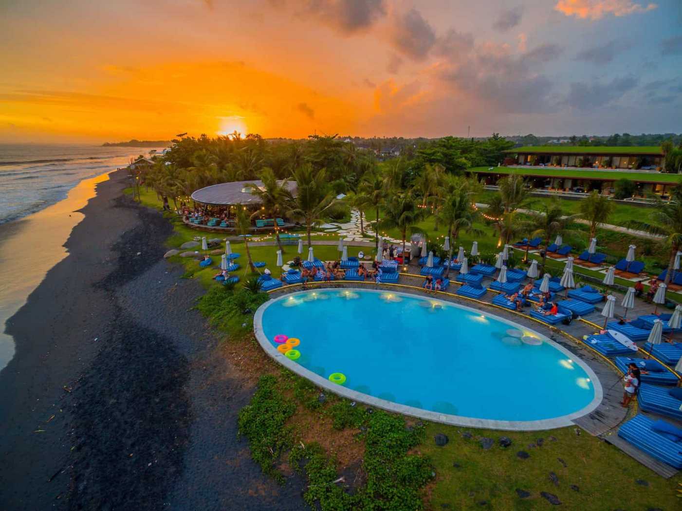 Komune Beach Club Keramas — Coastal pool and buildings