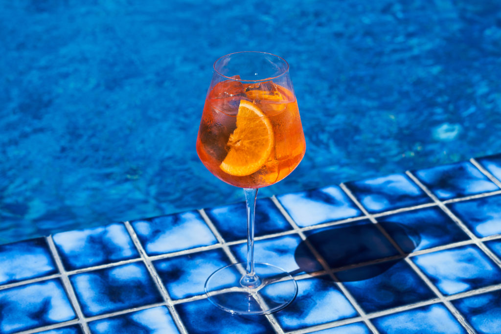 Blue pool and cocktail close-up