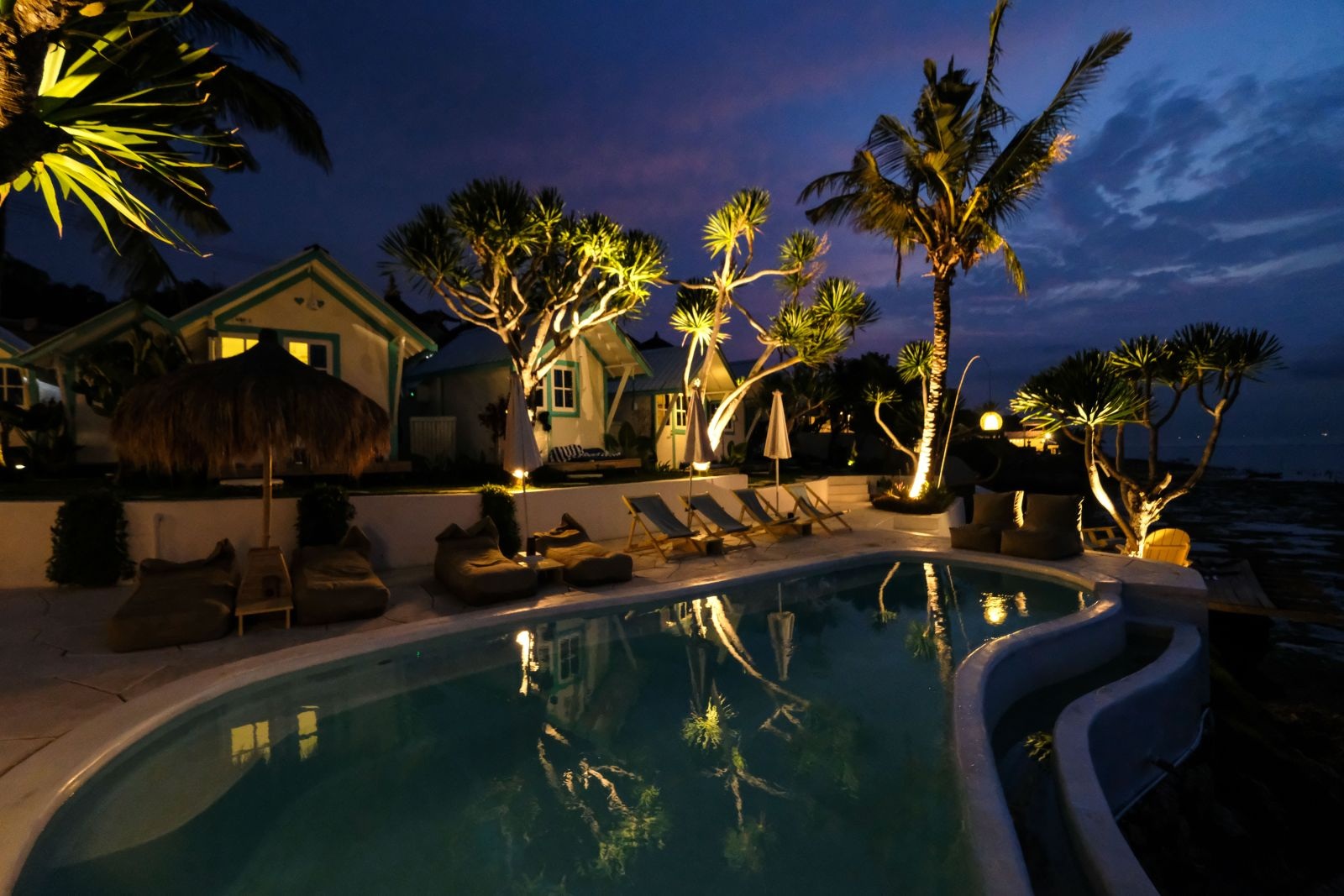 Pool and cottages at blue hour
