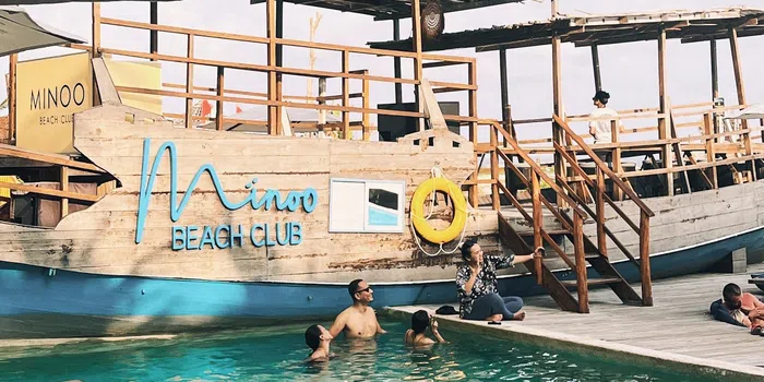 Pool and sign photo spot at Minoo Beach Club.