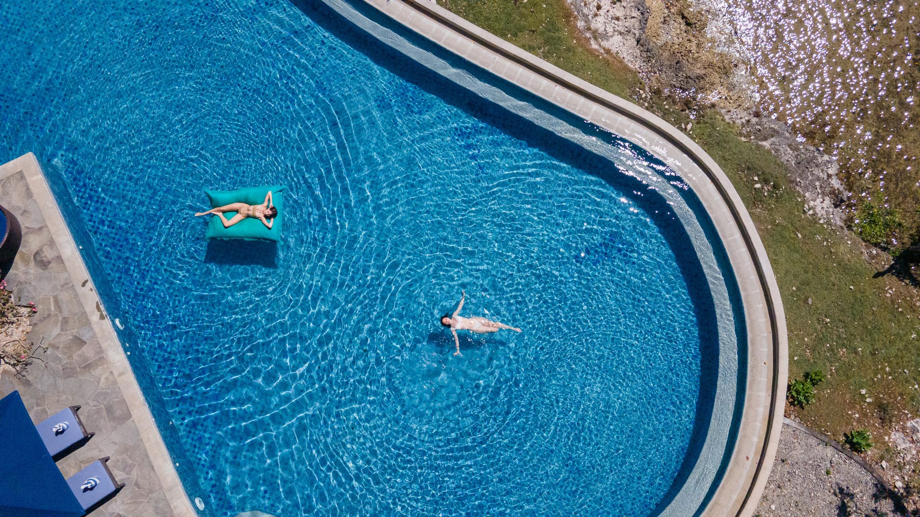 Infinity pool beside the sea