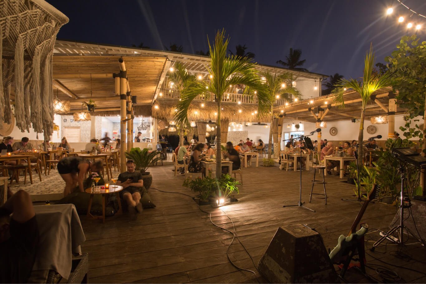 Penida Colada Beach Bar — Seafront venue by night