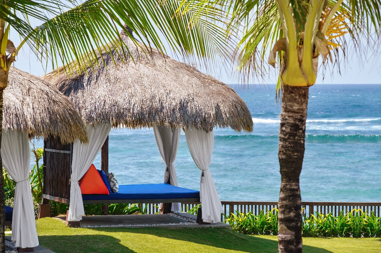 Beach cabana and palms