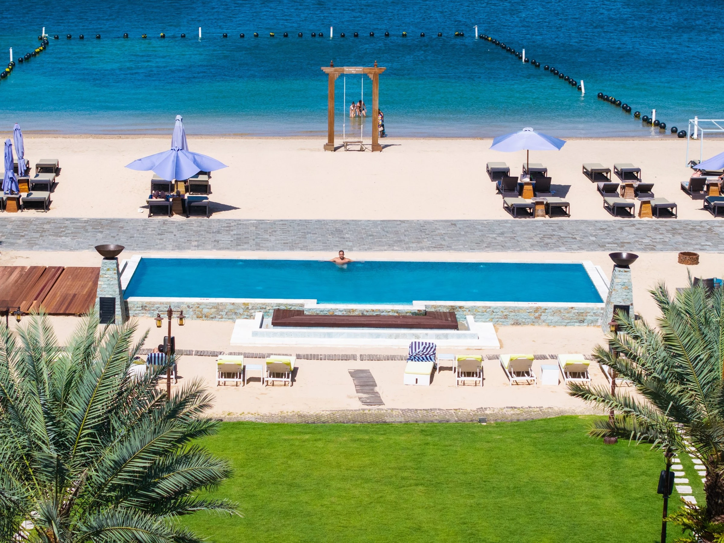 Sakala Beach Club — Beachfront Pool beside the sand