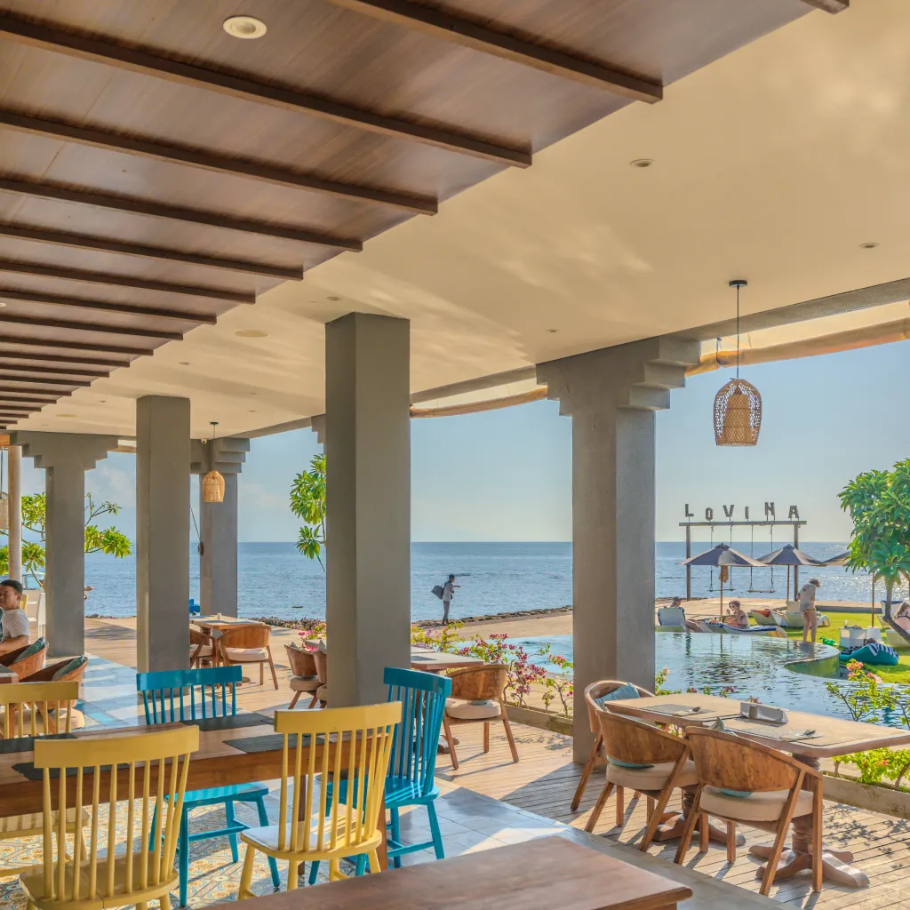 Sea Sky Lovina dining terrace overlooking the pool and sea