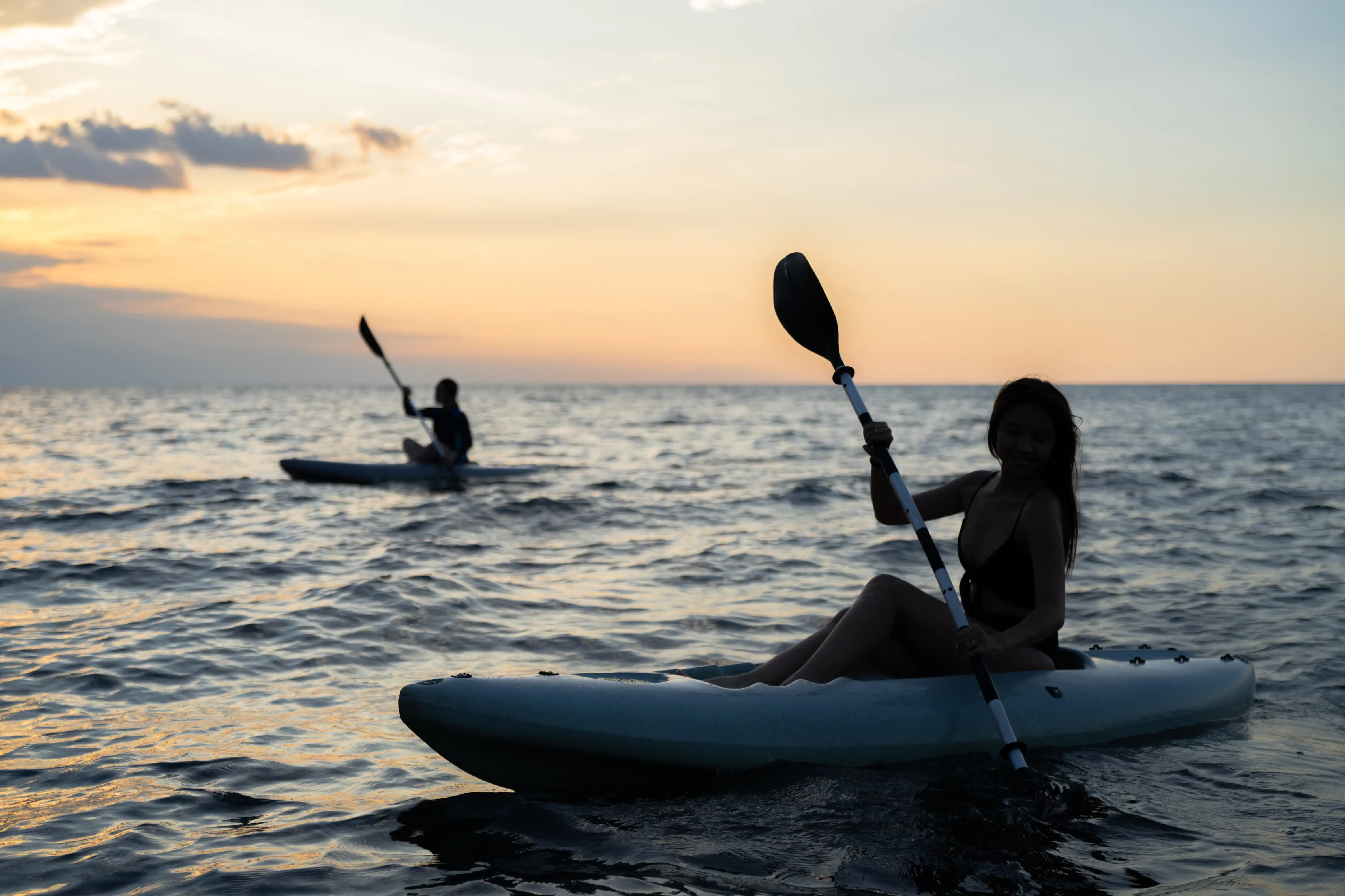 Canoe silhouetted at sunset on the Lovina sea