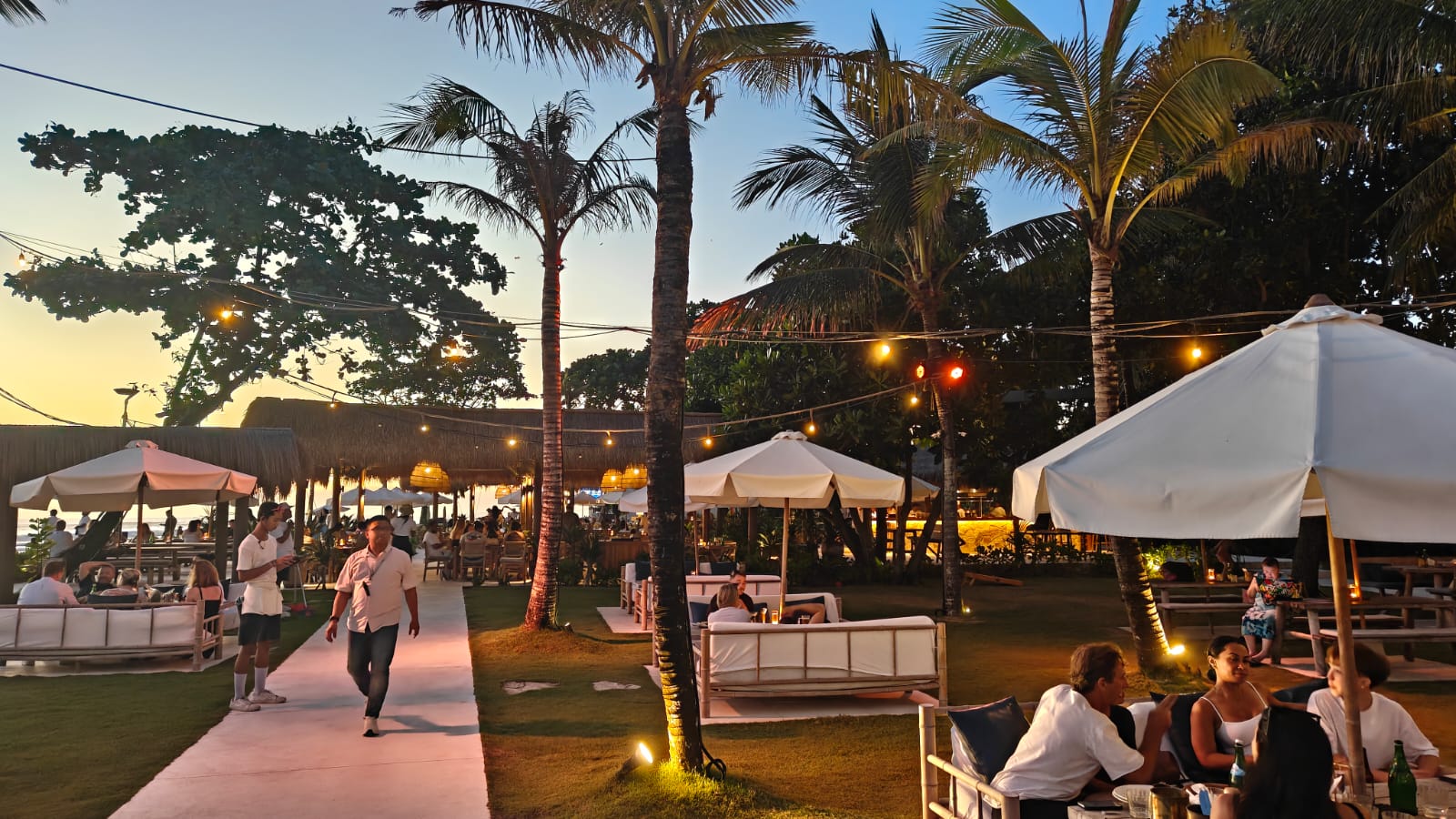 Evening walkway and venue mood at Suka Sunset Beach Club