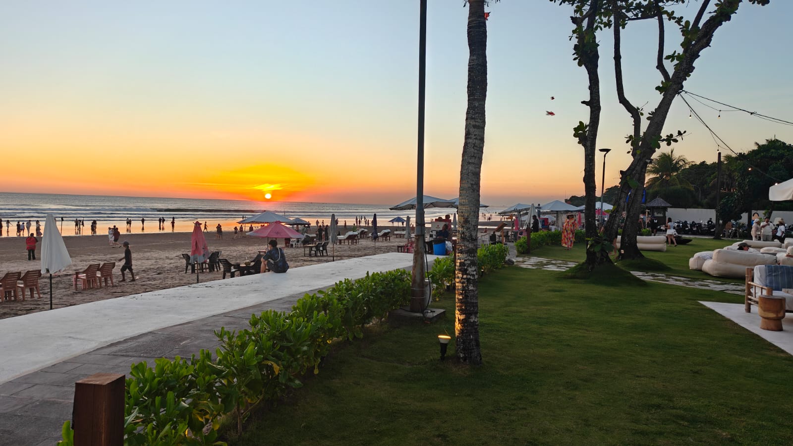 Sunset lawn view toward the ocean at Suka Sunset Beach Club