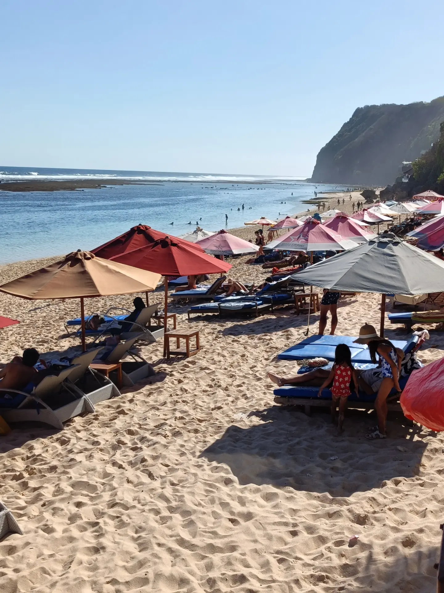 A Beach Break beneath the Parasols