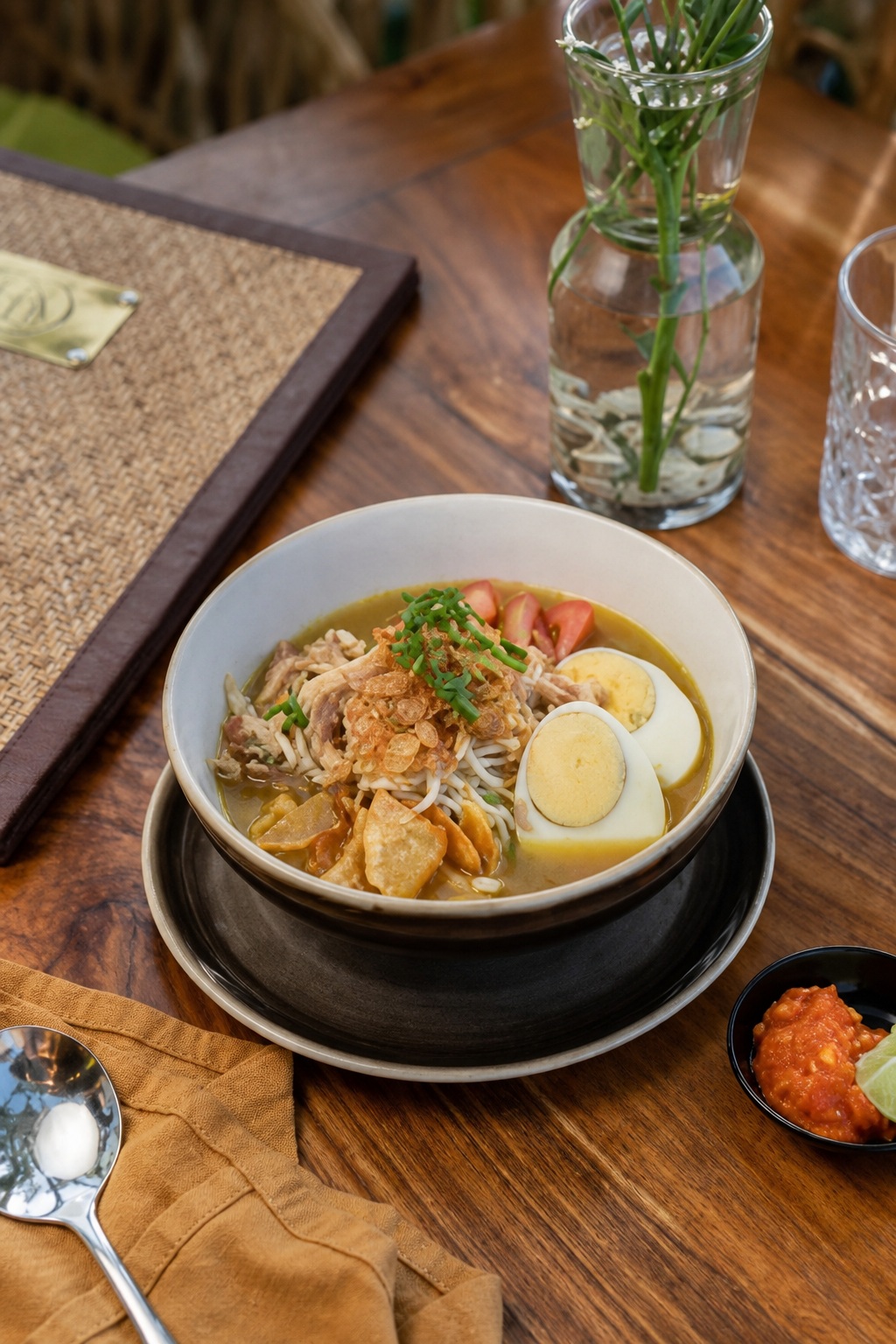 A noodle dish with toppings served at TIS Cafe Ubud