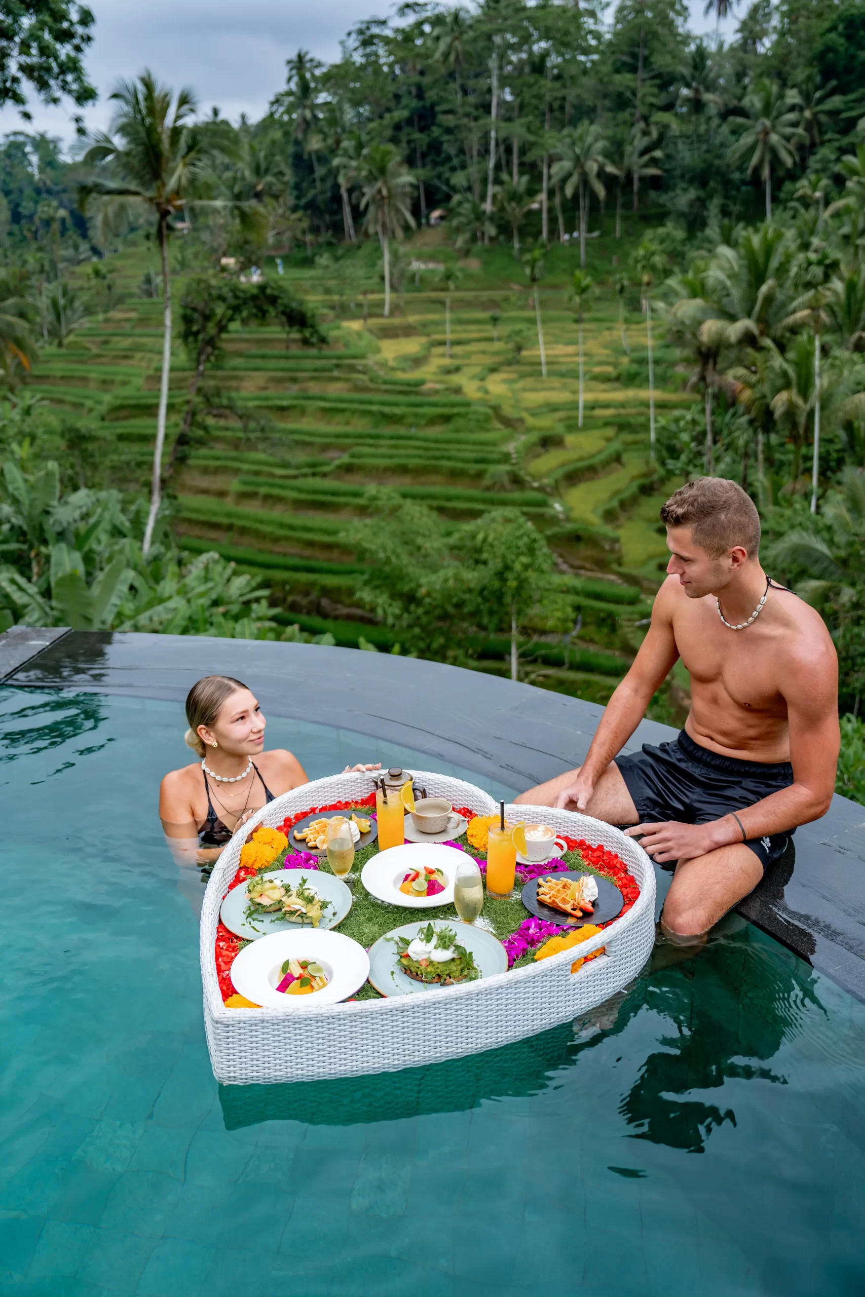 Floating breakfast tray in the TIS Cafe Ubud pool overlooking the rice terraces