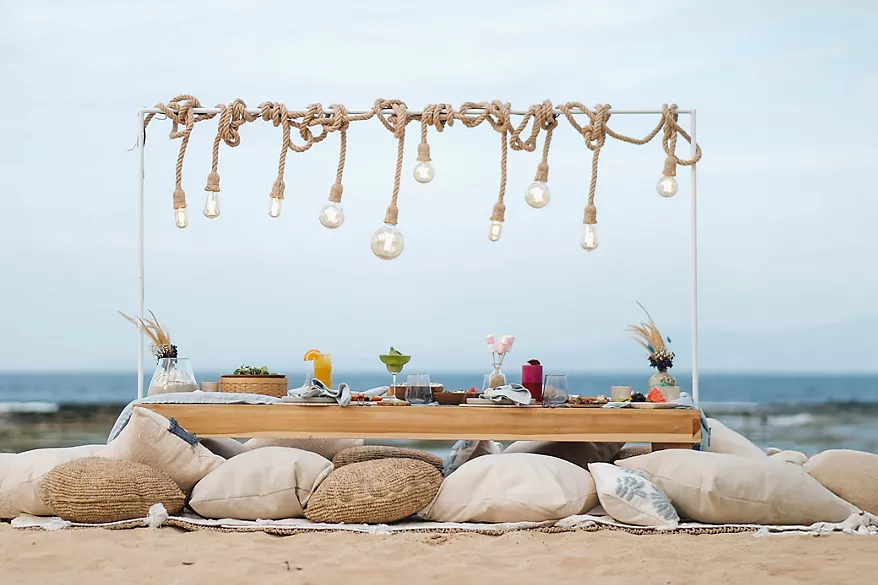 Chic Picnic low table and cushions on the sand