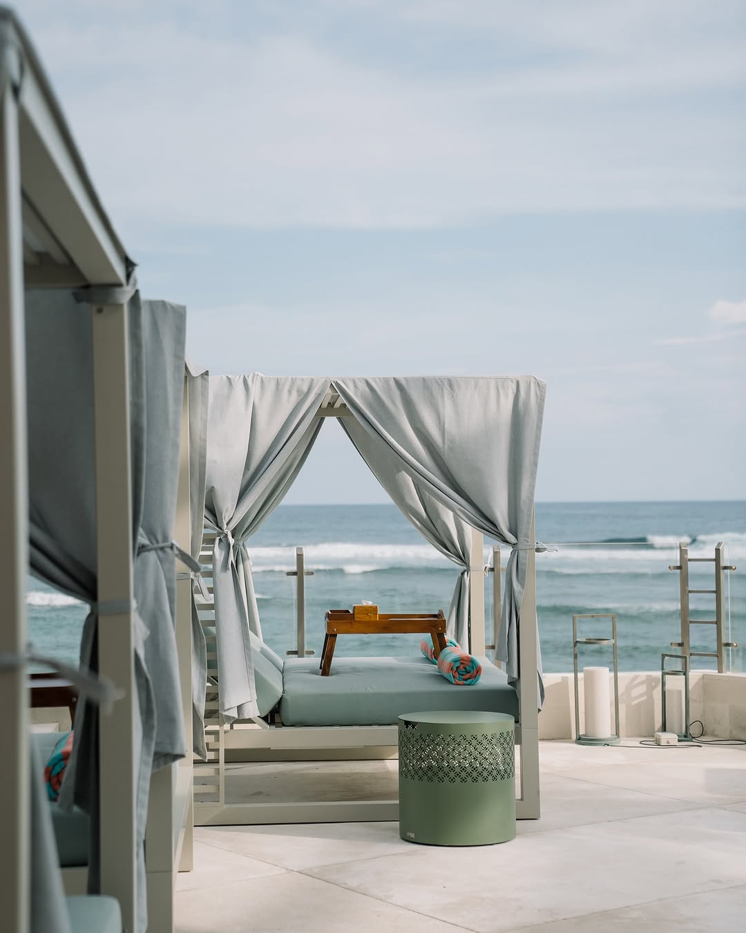 Sea framed by cabana curtains