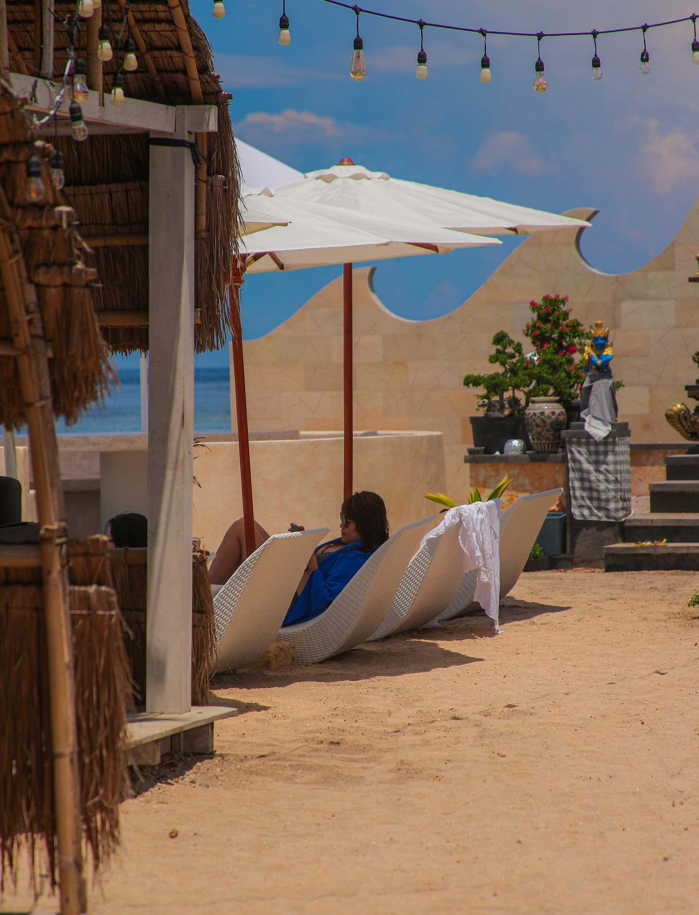 Parasols and a relaxed sandy area