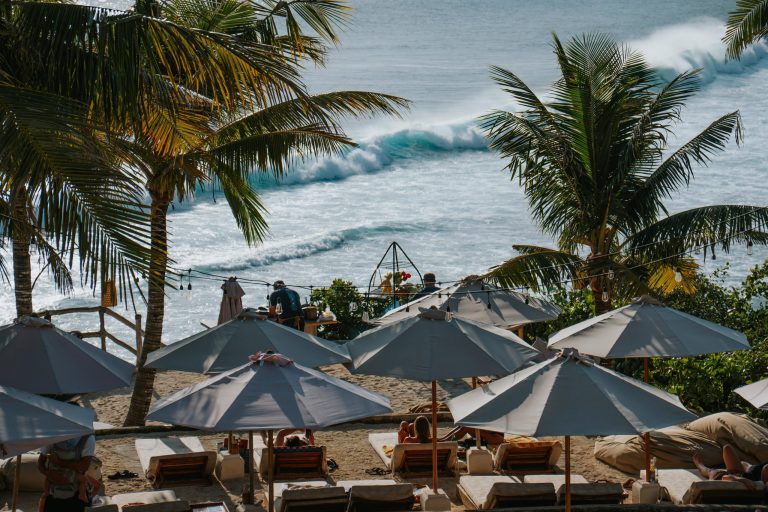 Suku Beach Club beach umbrellas and ocean view