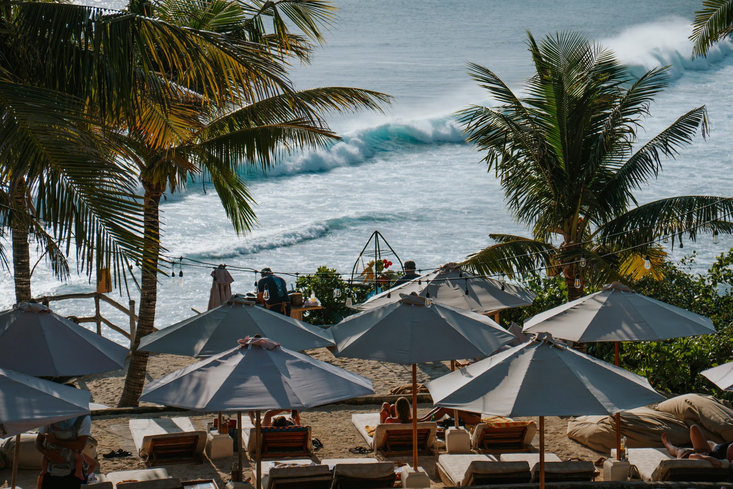 Suku Beach Club beach umbrellas and ocean view