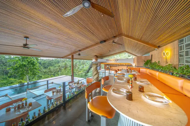 Dining and bar overlooking the jungle and pool at Habitat Bistro Ubud