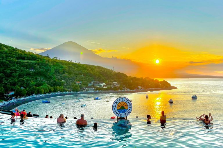 Infinity pool at Sunset Point Amed Bali overlooking the ocean and Mount Agung