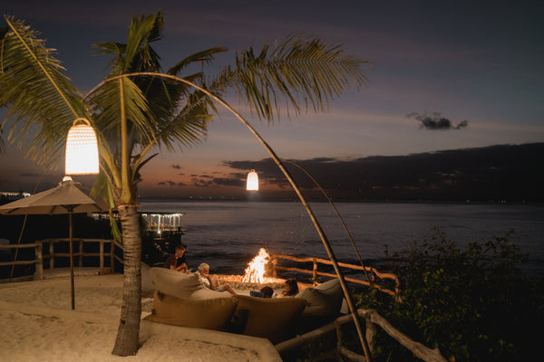 Suku Beach Club sunset firepit scene