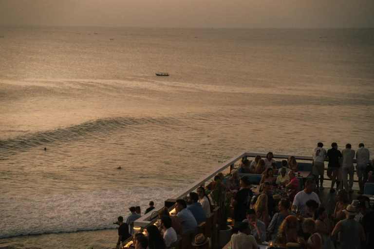 Single Fin Bali ocean-view deck seating above Uluwatu surf