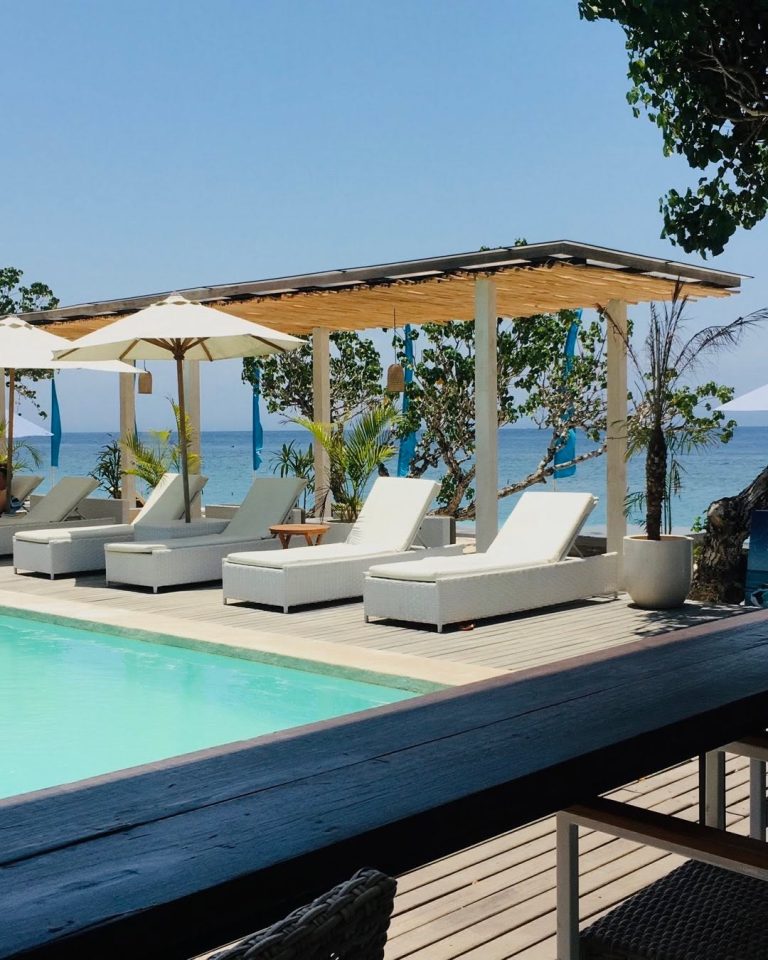 AMP Beach Club poolside daybeds and ocean view