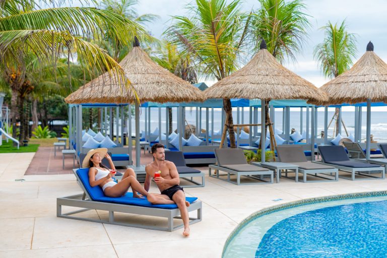 Flamingo Beach Club Bali pool and oceanfront seating