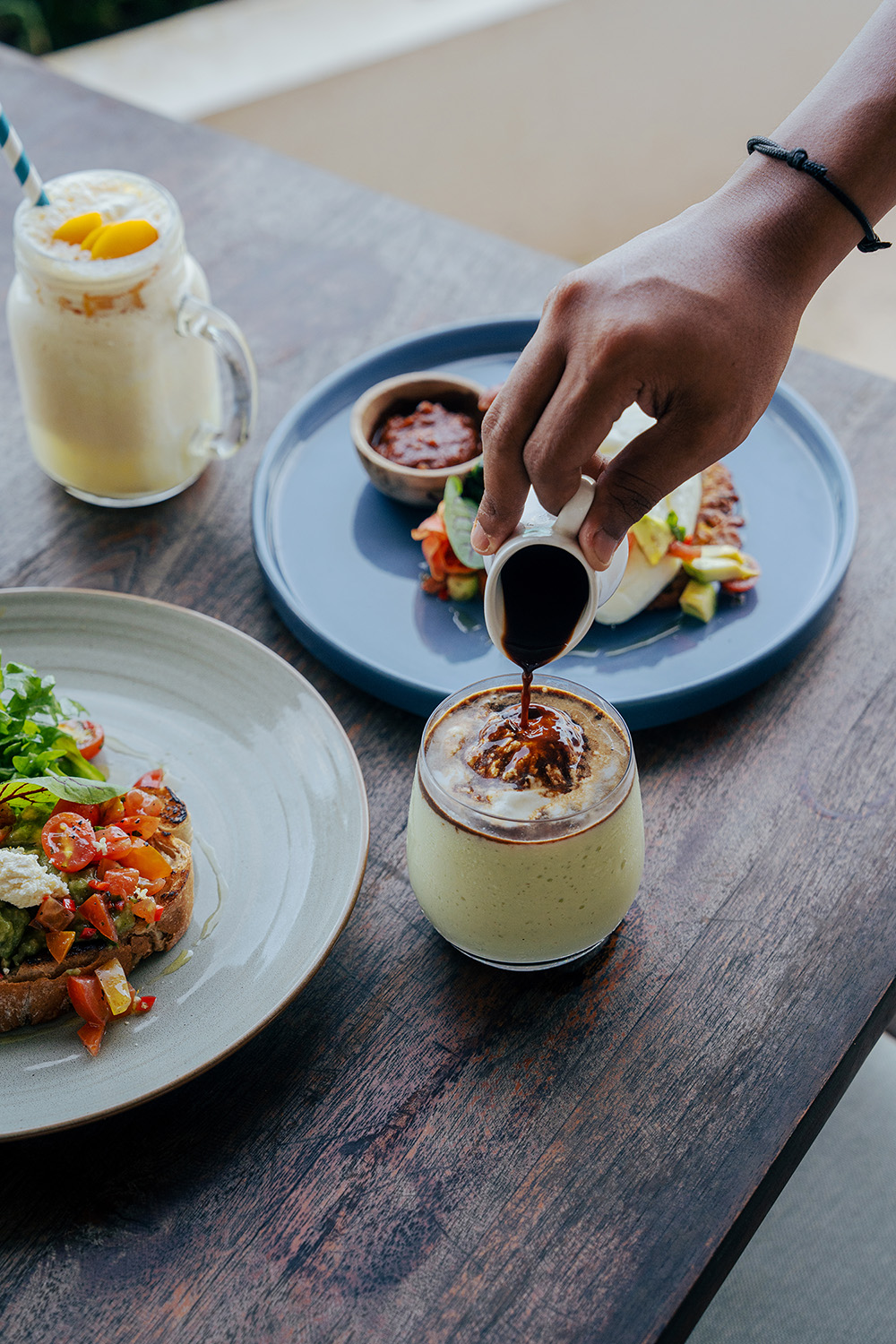 Food and drinks on a dining table at Klyf Club