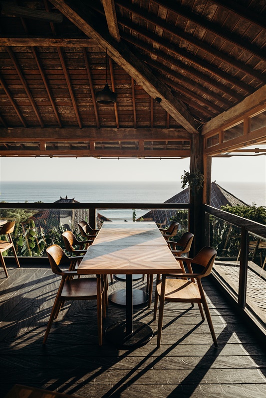 Mana Uluwatu open-air dining deck with ocean view